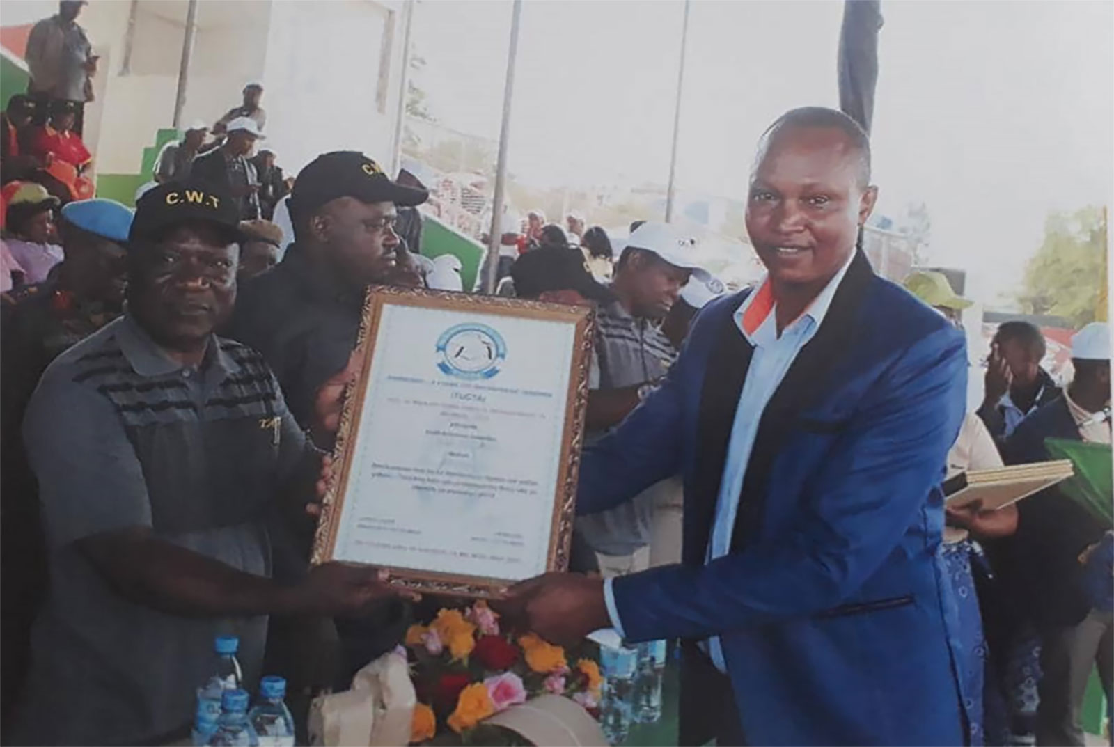 Two men holding a certificate